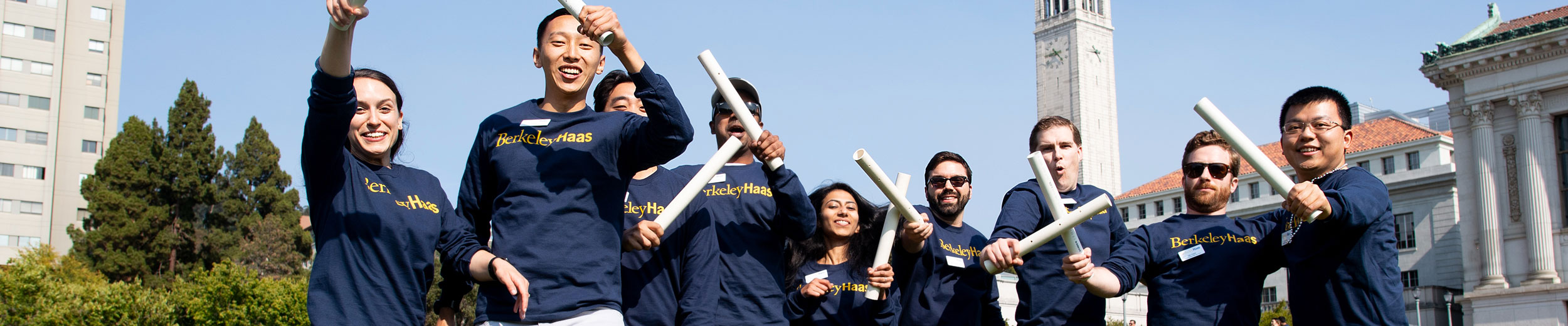 People holding up PVC pipes