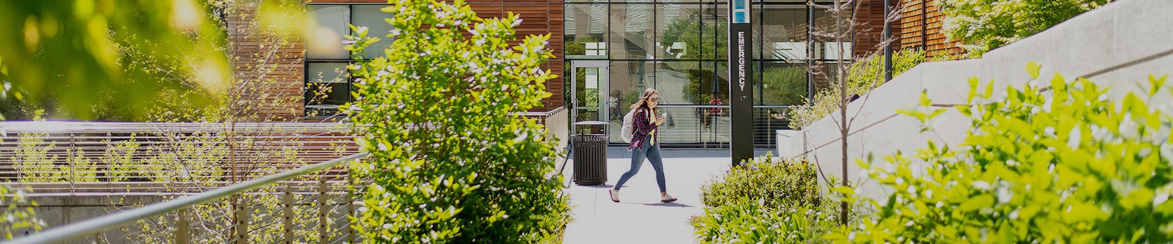 Woman walking through campus